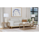 Kingsley light wood coffee table collection styled in a modern living room with matching square end tables