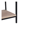 Macro view of Tate table base showing lower light wood shelf and black metal leg