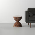 Julien Solid Wood Block End Table - sculptural wooden side table with a rounded block design and natural wood grain beside a sofa.