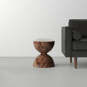 Julien Solid Wood Block End Table - sculptural wooden side table with a rounded block design and natural wood grain beside a sofa.