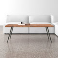 Walden rectangular live edge solid wood coffee table with angled metal legs styled in a room