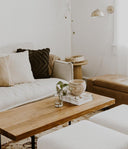 Walden rectangular solid wood coffee table styled in a warm boho living room