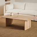 Scott rectangular light oak wood coffee table with slab panel legs styled in an organic modern living room