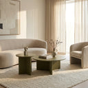 Aidan Cross Legs End Table set arranged beside a cream sofa and lounge chair in a sunlit modern interior.