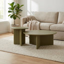 Aidan Cross Legs End Table set in an earthy living space with decorative vase, books, and soft natural lighting.