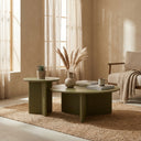 Aidan Cross Legs End  Table pair in a light-toned living room, with the larger table holding books and decorative accents.