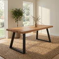 Emir Solid 6 Seater Dining Table with a natural wood tabletop and black metal trestle-style legs in a bright dining room.
