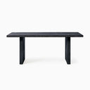 Close detail of the dark Nixon Rosa Plank Dining Table highlighting the tabletop corner, crisp edge and vertical wood grain