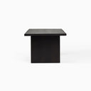Nixon Rosa Plank Dining Table photographed from an angled front view, showcasing the dark wood finish and spacious tabletop.