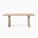 Close-up of the Nixon Rosa Plank Dining Table showing the layered tabletop edge, natural wood grain and solid panel leg.