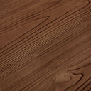 Detailed corner view of the Nixon Rosa Plank Dining Table revealing the warm wood finish, plank construction and tabletop edging.