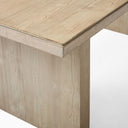 Dark finish Nixon Rosa Plank 6 Seater Dining Table positioned on a woven rug in a warm modern interior with large windows.