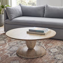 Leandro round natural wood coffee table with a stacked goblet pedestal base styled in a living room