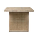 Natural finish Dennis Woven Rectangle Dining Table featuring cane-front supports and a spacious rectangular tabletop.